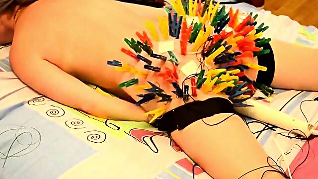 More than a hundred clothespins on her butt!