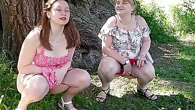 Two women. Cute real virgin brunette girl and blonde mature milf lifted short skirt, took off red